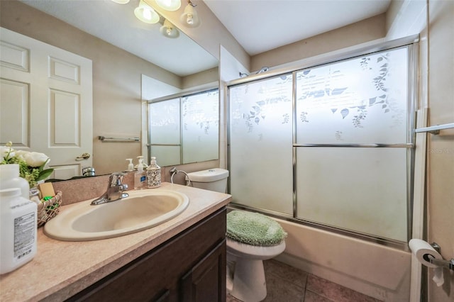 742 Seneca Trl, Saint Cloud, FL 34772 - full bathroom featuring toilet, vanity, bath / shower combo with glass door, and tile patterned flooring
