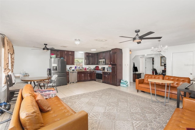 3280 Pinto Dr, Kissimmee, FL 34746 - living room with a ceiling fan, a chandelier, and light tile patterned floors