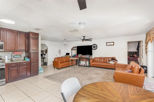 3280 Pinto Dr, Kissimmee, FL 34746 - living area featuring ceiling fan, light tile patterned floors, and a chandelier