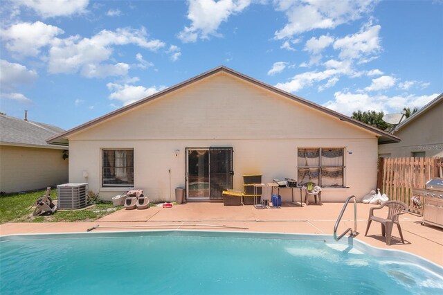 3280 Pinto Dr, Kissimmee, FL 34746 - back of property featuring an outdoor pool, a patio, and stucco siding