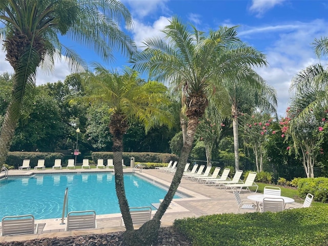 6100 Stevenson Dr Unit 207, Orlando, FL 32835 - community pool featuring a patio area