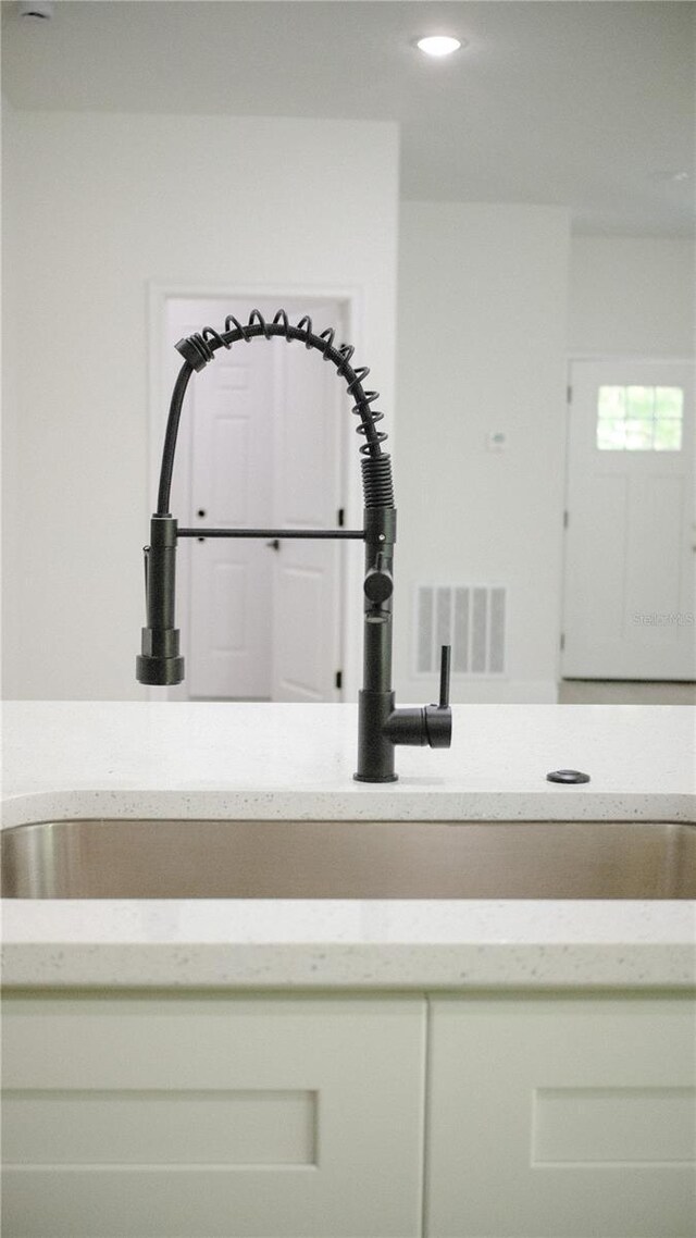 2498 W Magenta Dr, Citrus Springs, FL 34434 - kitchen view of recessed lighting and light stone countertops