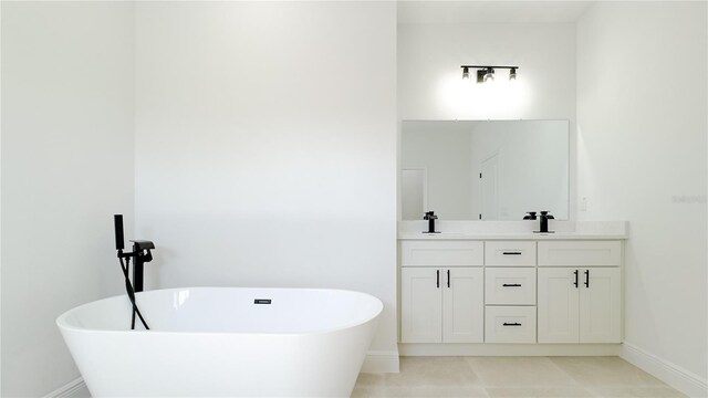 2498 W Magenta Dr, Citrus Springs, FL 34434 - full bathroom with double vanity, a soaking tub, and tile patterned flooring