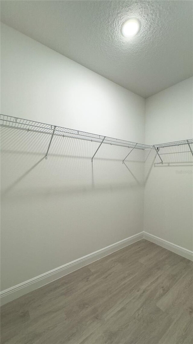 2498 W Magenta Dr, Citrus Springs, FL 34434 - spacious closet with wood finished floors