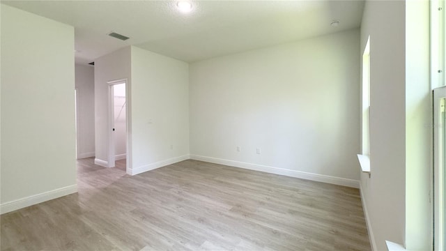 2498 W Magenta Dr, Citrus Springs, FL 34434 - unfurnished room with light wood finished floors and baseboards