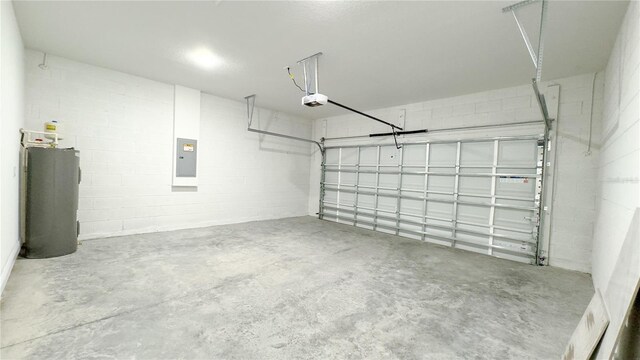 2498 W Magenta Dr, Citrus Springs, FL 34434 - garage featuring a garage door opener, water heater, electric panel, and concrete block wall