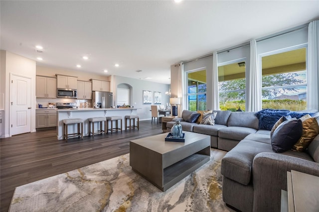 3224 Arch Ave, Ormond Beach, FL 32174 - living area with dark wood-style floors, recessed lighting, and baseboards
