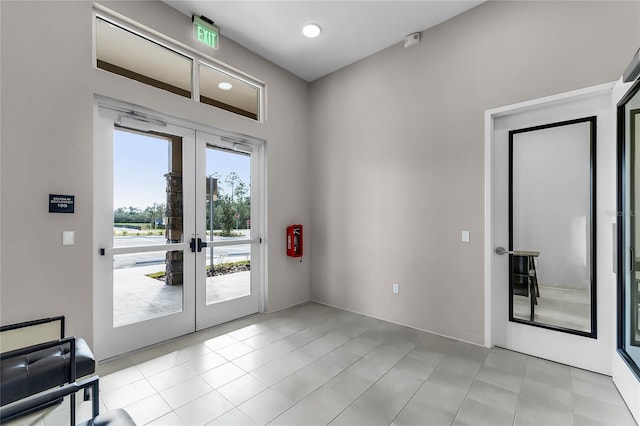 3224 Arch Ave, Ormond Beach, FL 32174 - doorway with french doors, light tile patterned floors, and recessed lighting