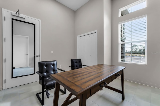 3224 Arch Ave, Ormond Beach, FL 32174 - office space with healthy amount of natural light, baseboards, and a high ceiling