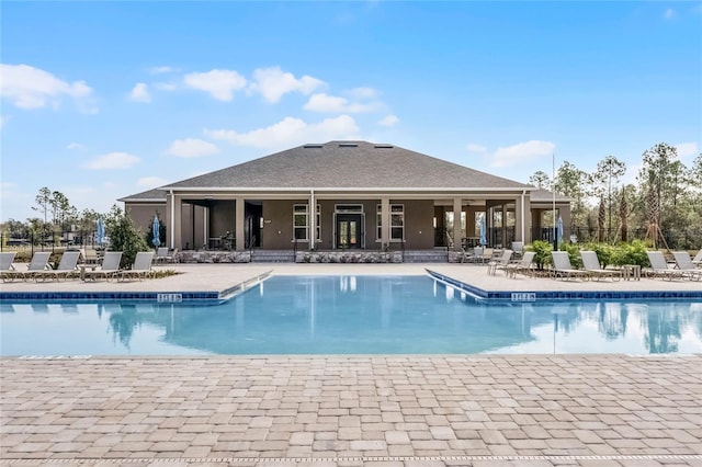 3224 Arch Ave, Ormond Beach, FL 32174 - community pool featuring a patio area