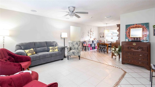 5177 Chesapeake Ave, Orlando, FL 32808 - living room featuring ceiling fan and light tile patterned floors