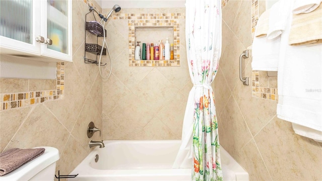 5177 Chesapeake Ave, Orlando, FL 32808 - bathroom with shower / bath combination with curtain and tile walls