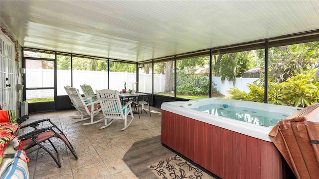 5177 Chesapeake Ave, Orlando, FL 32808 - sunroom / solarium with a hot tub, plenty of natural light, and outdoor dining space