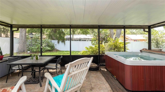 5177 Chesapeake Ave, Orlando, FL 32808 - sunroom / solarium with a jacuzzi and outdoor dining space