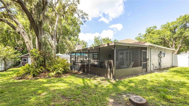 5177 Chesapeake Ave, Orlando, FL 32808 - back of property featuring a sunroom and a chimney
