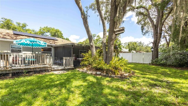 5177 Chesapeake Ave, Orlando, FL 32808 - view of yard with a sunroom and a deck