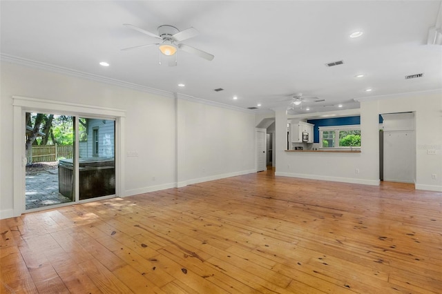 408 W Pearl St, Minneola, FL 34715 - unfurnished living room featuring a ceiling fan, ornamental molding, light wood finished floors, and recessed lighting