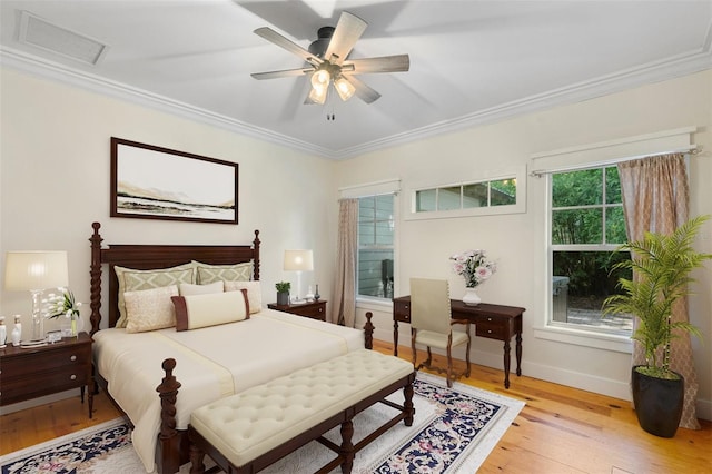 408 W Pearl St, Minneola, FL 34715 - bedroom with crown molding, light wood finished floors, and ceiling fan