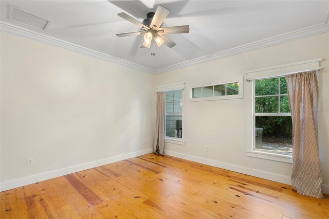 408 W Pearl St, Minneola, FL 34715 - empty room featuring ornamental molding, light wood-type flooring, a ceiling fan, and attic access