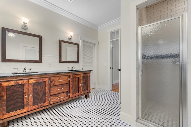 408 W Pearl St, Minneola, FL 34715 - bathroom featuring a shower stall, double vanity, ornamental molding, and tile patterned floors