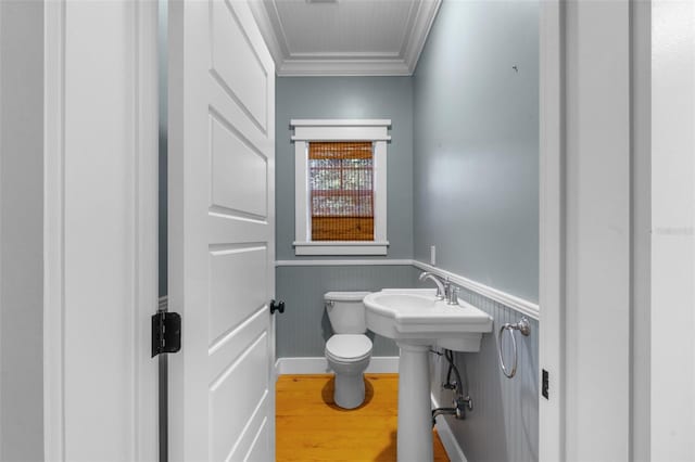 408 W Pearl St, Minneola, FL 34715 - half bath with crown molding, a wainscoted wall, and wood finished floors