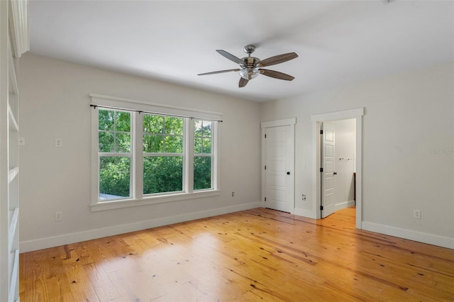 408 W Pearl St, Minneola, FL 34715 - unfurnished bedroom featuring light wood-type flooring and ceiling fan