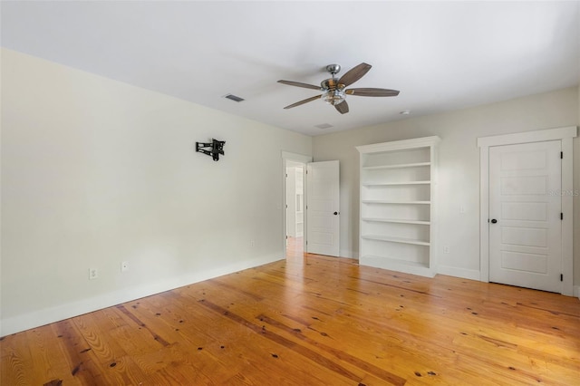 408 W Pearl St, Minneola, FL 34715 - unfurnished bedroom with light wood-style flooring and ceiling fan