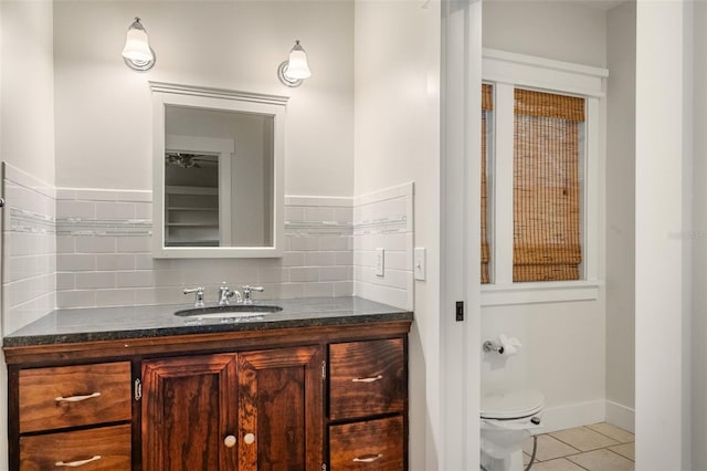 408 W Pearl St, Minneola, FL 34715 - bathroom with vanity, tile patterned floors, and backsplash