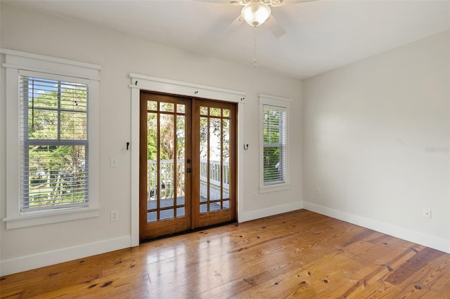 408 W Pearl St, Minneola, FL 34715 - entryway with french doors, a ceiling fan, and wood finished floors