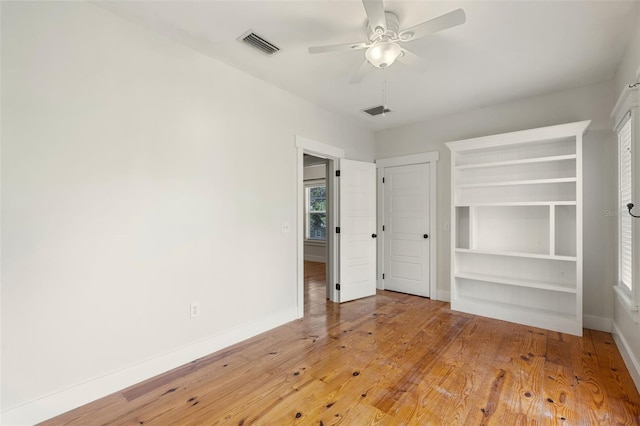 408 W Pearl St, Minneola, FL 34715 - spare room with light wood-style floors and a ceiling fan