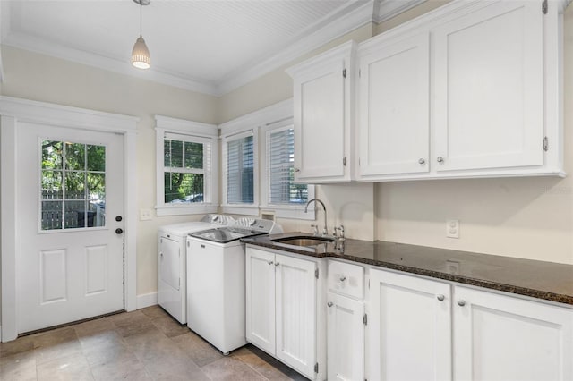 408 W Pearl St, Minneola, FL 34715 - laundry room with cabinet space, independent washer and dryer, ornamental molding, and light stone finish floors