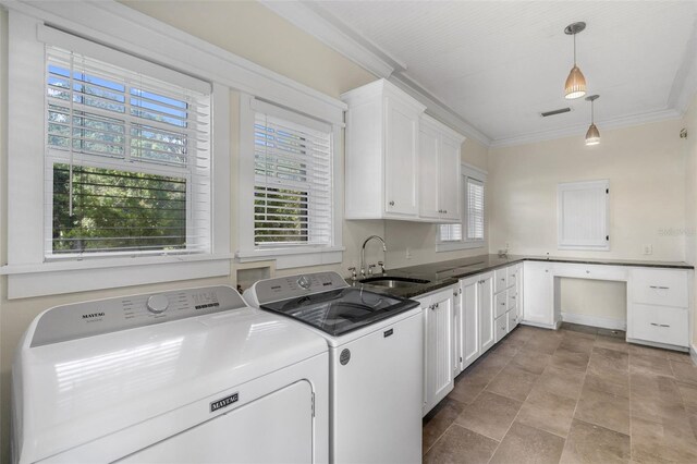 408 W Pearl St, Minneola, FL 34715 - laundry room featuring cabinet space, washing machine and clothes dryer, ornamental molding, and stone finish flooring