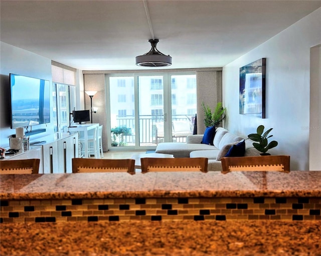 2947 S Atlantic Ave Unit 601, Daytona Beach, FL 32118 - living room with plenty of natural light and a wall of windows