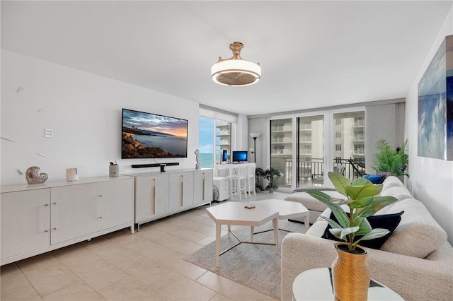 2947 S Atlantic Ave Unit 601, Daytona Beach, FL 32118 - living room with a wall of windows and light tile patterned floors