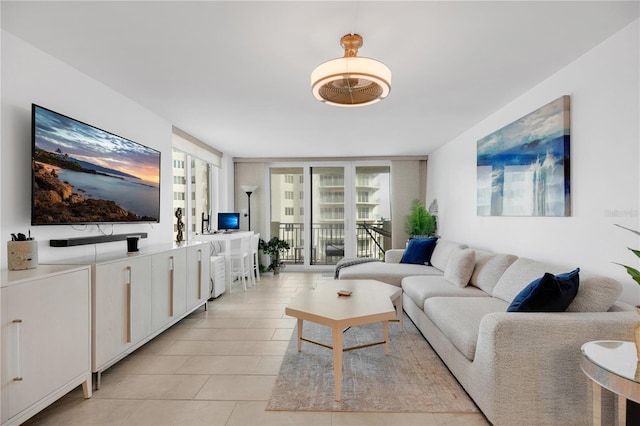 2947 S Atlantic Ave Unit 601, Daytona Beach, FL 32118 - living room featuring floor to ceiling windows and light tile patterned flooring