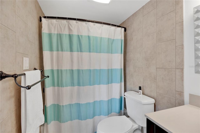 2947 S Atlantic Ave Unit 601, Daytona Beach, FL 32118 - full bathroom featuring tile walls, vanity, and curtained shower