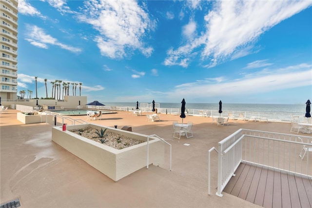2947 S Atlantic Ave Unit 601, Daytona Beach, FL 32118 - view of home's community with a water view, a patio area, and a swimming pool