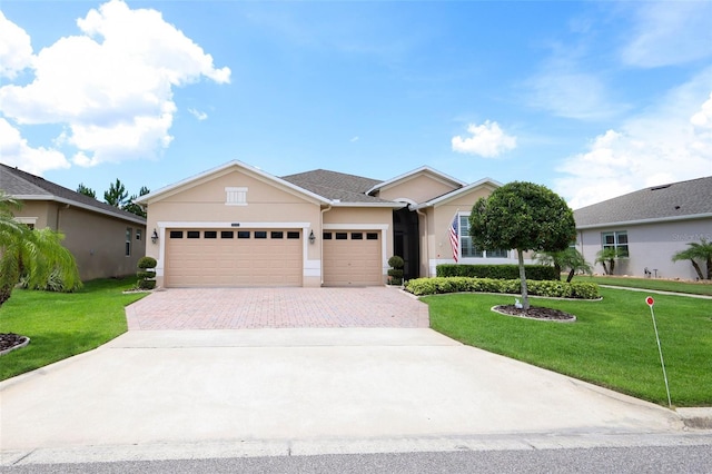3574 La Jolla Dr, Clermont, FL 34711 - ranch-style home with stucco siding, decorative driveway, a garage, and a front lawn