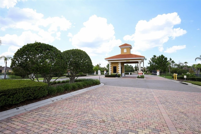 3574 La Jolla Dr, Clermont, FL 34711 - view of decorative road with curbs and a gated entry