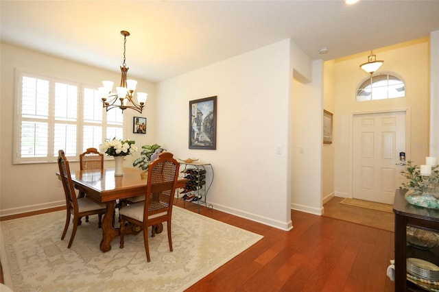 3574 La Jolla Dr, Clermont, FL 34711 - dining space featuring a chandelier and wood finished floors