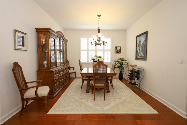 3574 La Jolla Dr, Clermont, FL 34711 - dining room featuring a chandelier and dark wood-style flooring