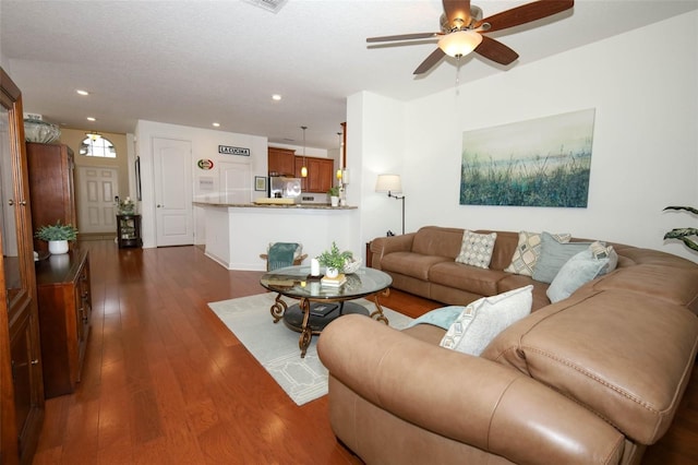 3574 La Jolla Dr, Clermont, FL 34711 - living room with dark wood-style floors, ceiling fan, and recessed lighting