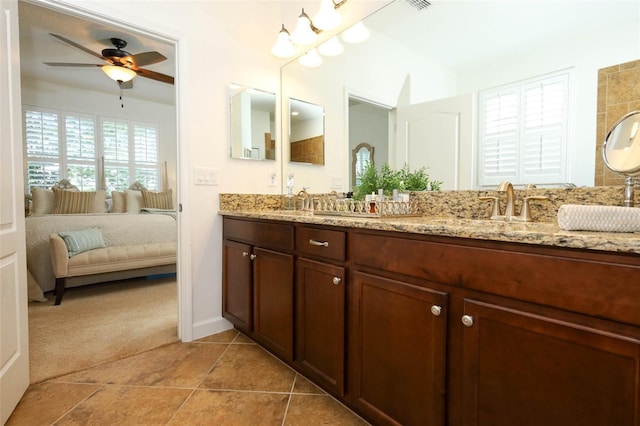 3574 La Jolla Dr, Clermont, FL 34711 - ensuite bathroom with double vanity, a ceiling fan, and tile patterned floors