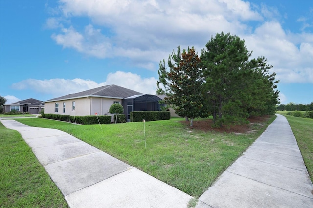 3574 La Jolla Dr, Clermont, FL 34711 - view of side of home featuring a lawn and stucco siding