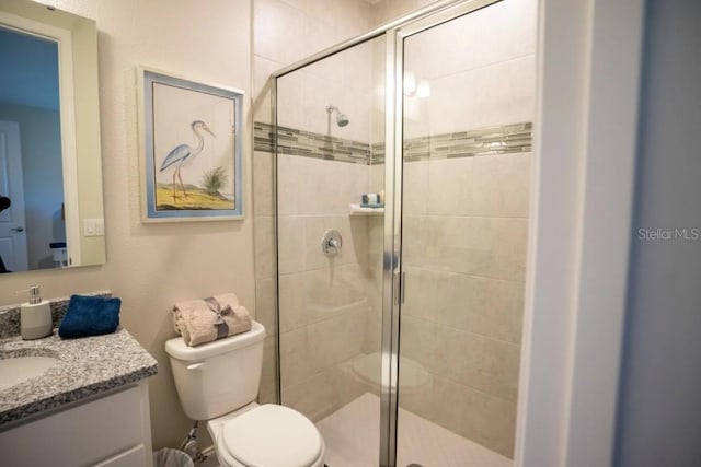 351 S Sunset Ave, Mascotte, FL 34753 - bathroom with vanity, toilet, and a shower stall
