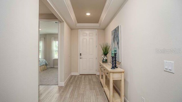 351 S Sunset Ave, Mascotte, FL 34753 - entrance foyer featuring ornamental molding, light wood-style flooring, baseboards, and recessed lighting