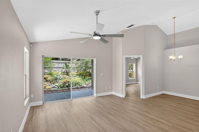 632 Bridge Creek Blvd, Ocoee, FL 34761 - unfurnished room featuring wood finished floors, high vaulted ceiling, a chandelier, and ceiling fan