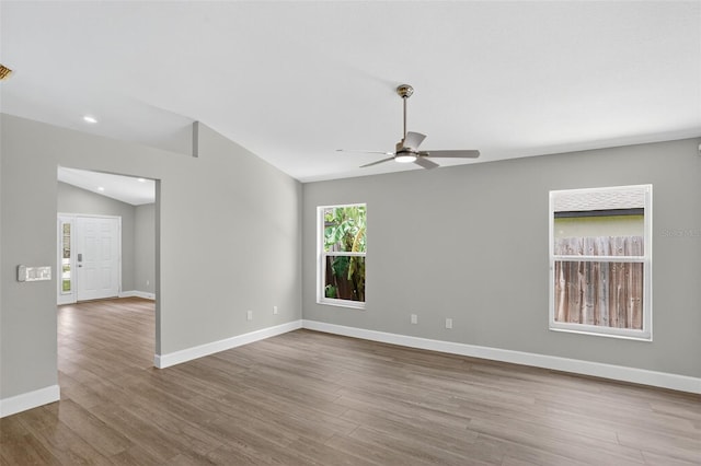 632 Bridge Creek Blvd, Ocoee, FL 34761 - unfurnished room featuring a ceiling fan, vaulted ceiling, wood finished floors, and recessed lighting