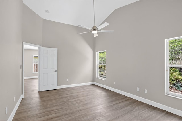 632 Bridge Creek Blvd, Ocoee, FL 34761 - unfurnished room with high vaulted ceiling, plenty of natural light, a ceiling fan, and wood finished floors