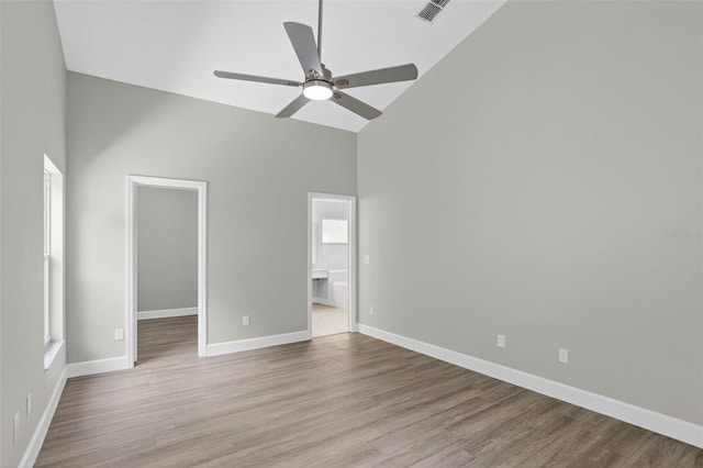 632 Bridge Creek Blvd, Ocoee, FL 34761 - unfurnished bedroom featuring high vaulted ceiling, a walk in closet, wood finished floors, ensuite bath, and a closet